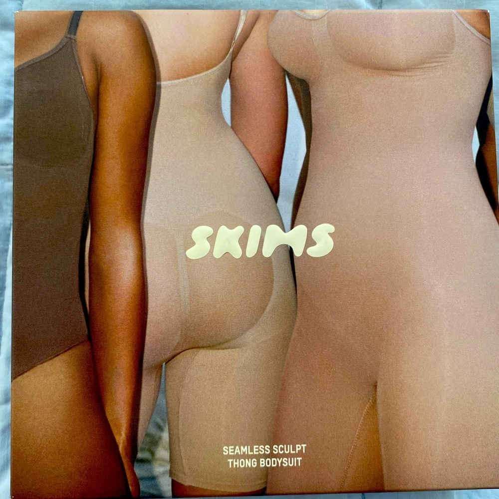 Skims seamless thong body suit, NWT, never taken out of box.